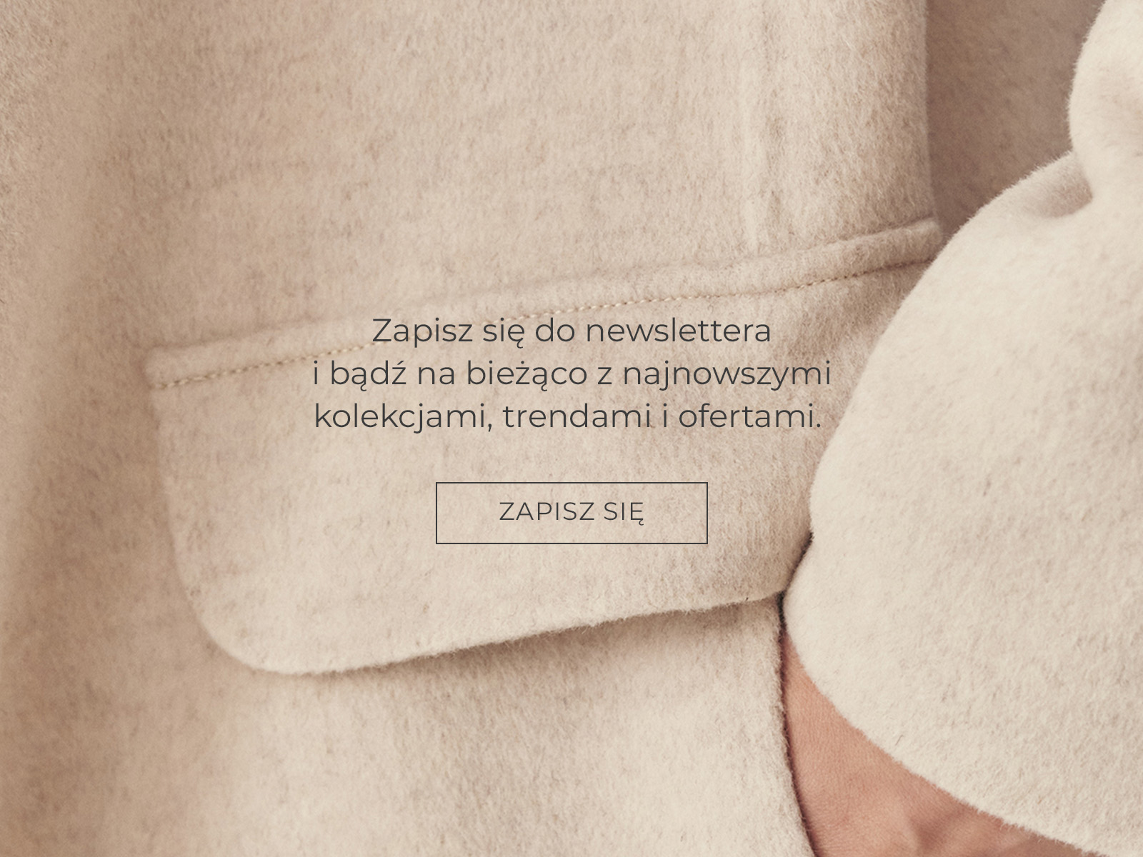 Zbliżenie na kieszeń zimowego płaszcza z zapisem do newslettera